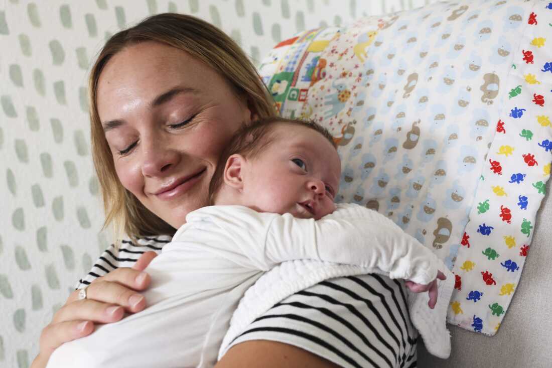 Mary Collins and her daughter, Rory. Mary closed her eyes and smiled quietly as she held her daughter. 